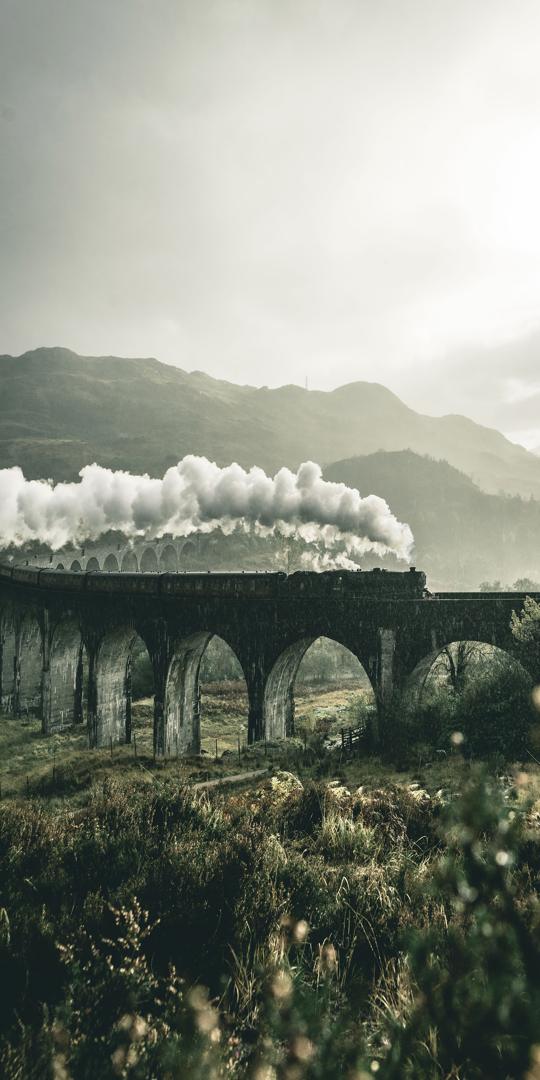 black-train-on-railway-bridge-under-heavy-clouds-8o.jpg