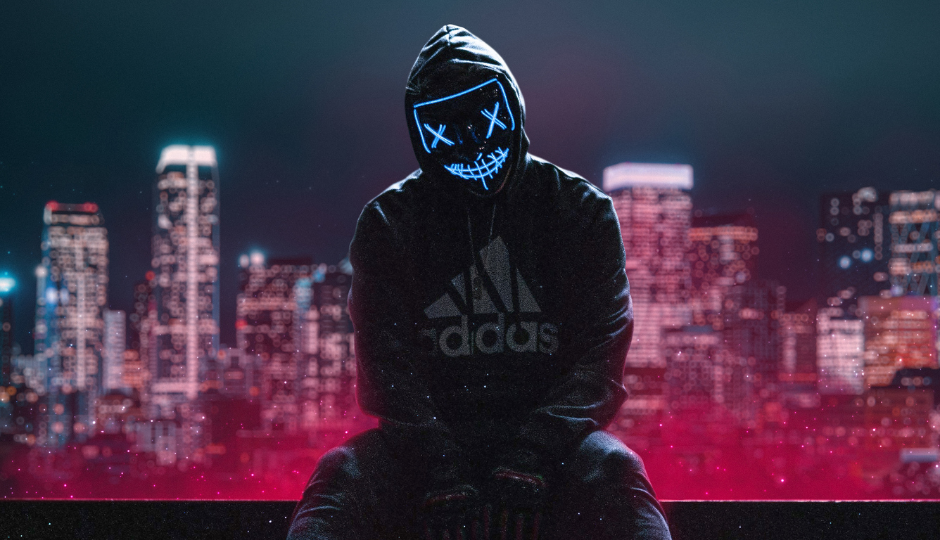 hoodie-boy-sitting-neon-mask-ub.jpg