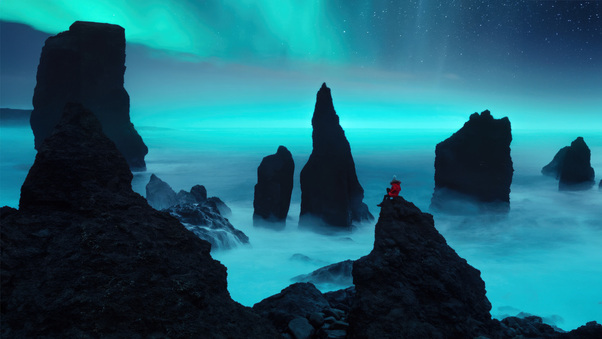 A Person Sitting On Rocks Aurora Bliss 5k Wallpaper