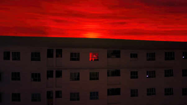 A Single Red Room In The City Of Red Skies Wallpaper