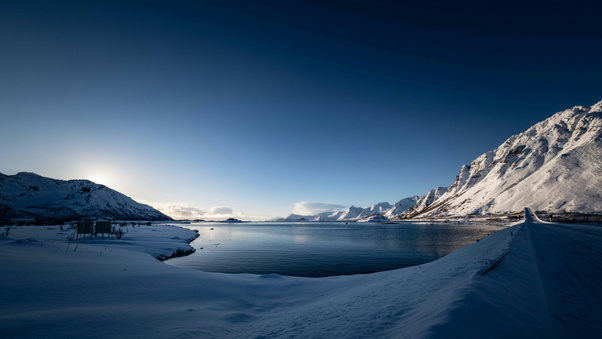 Arctic Fjord Surrounded By Snow Capped Peaks (1920x1080) Resolution Wallpaper