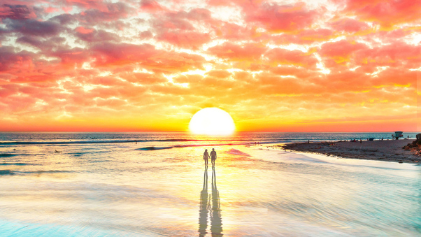 Beach Couple Watching Sunset 4k Wallpaper
