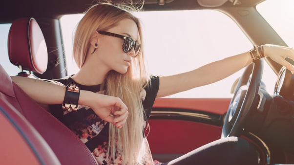 Blonde Girl Sitting In Car Wallpaper