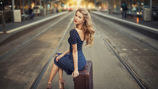 Blonde Girl Sitting Suitcase Train Station 4k Wallpaper