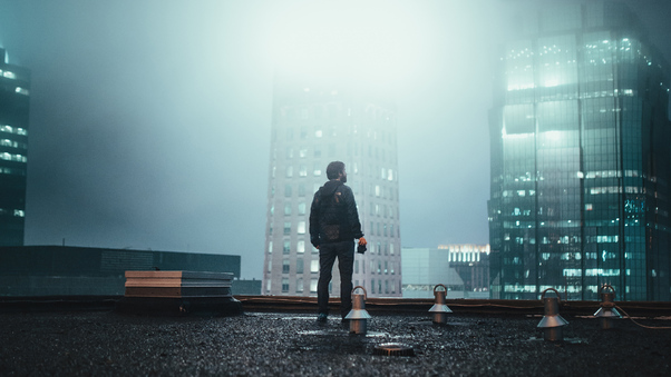 Boy Standing On Building Roof 4k Wallpaper
