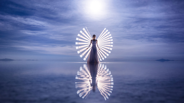 Brushstrokes Of Light Capturing A Girl In White Dress Presence Wallpaper