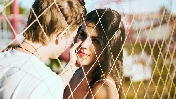 Couple Love At Fence Wallpaper