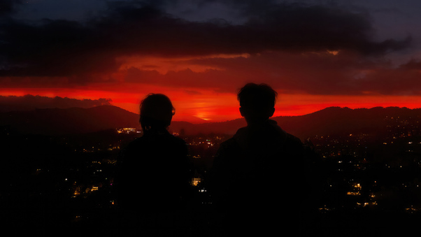 Couple Silhouette In Dark Sunset Wallpaper