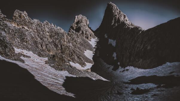 dark-mountains-covered-by-snow-5k-6i.jpg