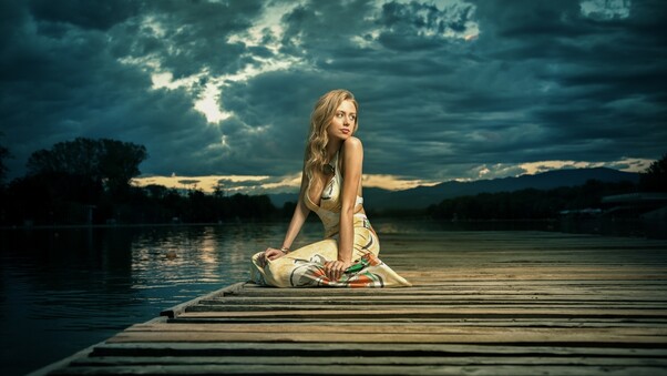 Girl Alone Sitting Near Lake Wallpaper