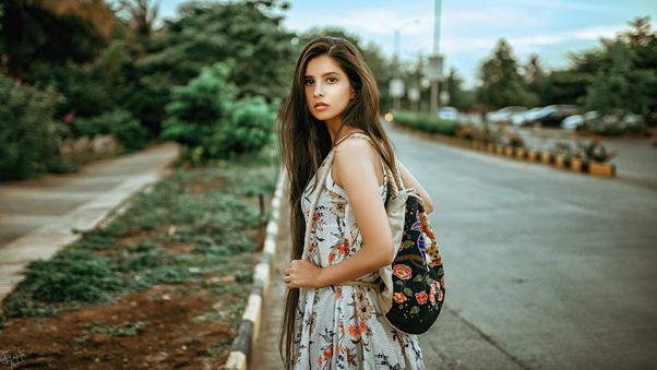 Girl Backpack Outdoors Looking Back 4k Wallpaper
