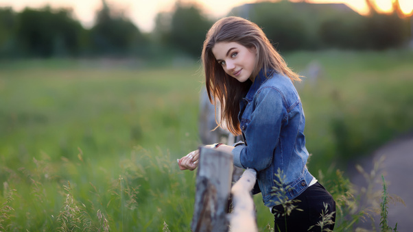 Girl In Denim At Sunset Fields Wallpaper