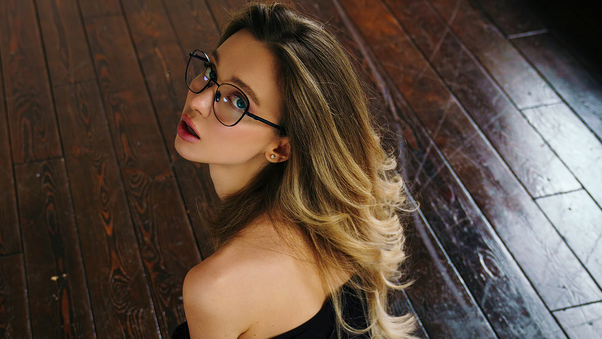 Girl In Glasses Looking Back Wallpaper