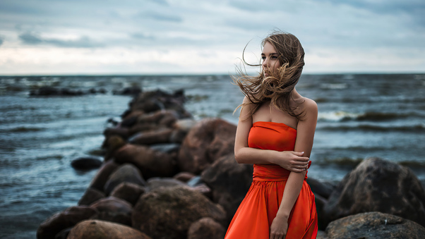 Girl In Orange Dress At Beach 4k Wallpaper