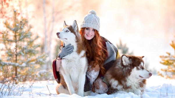 Girl In Snow With Siberian Husky Wallpaper
