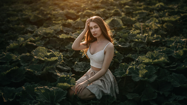 Girl In Vegetable Field Sun Rays From Behind Wallpaper