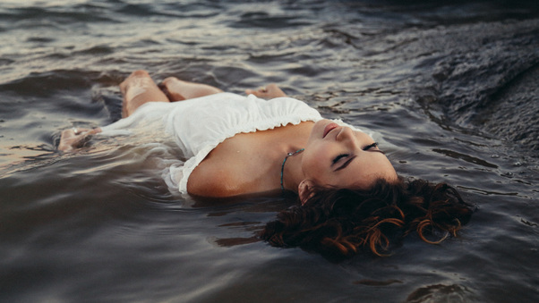 Girl Lying On Sea Shore Wet 5k Wallpaper