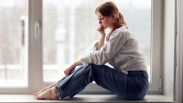Girl Sitting By The Window In Jeans Wallpaper