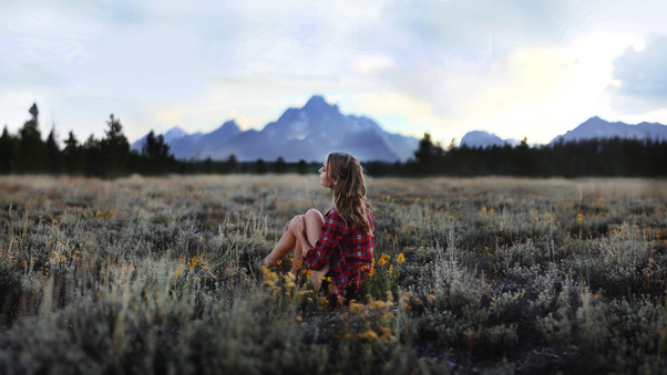Girl Sitting In Grasslands 4k Wallpaper
