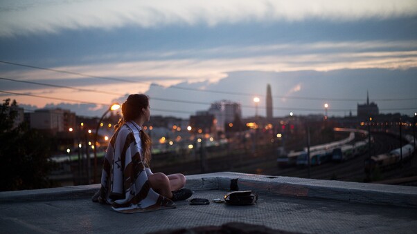 Girl Sitting On Rooftop Looking Towards Town 5k Wallpaper