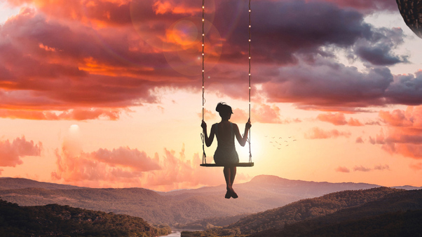 Girl Swinging On Top Of World Wallpaper