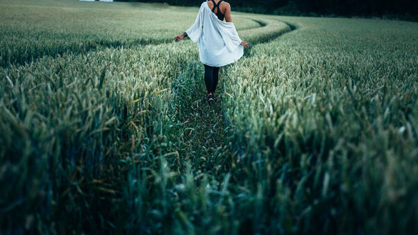 Girl Walking In Field Way Wallpaper
