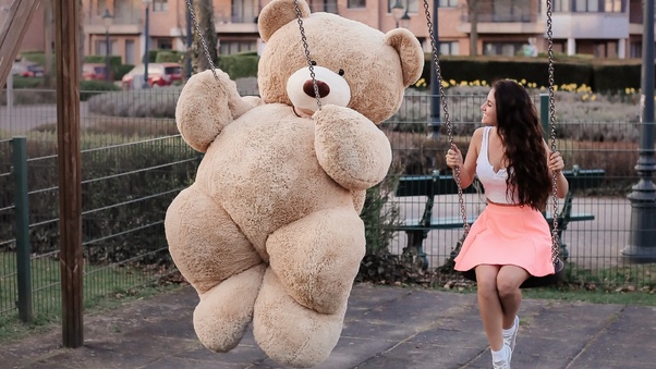 Girl With Big Teddy Bear On Swing Wallpaper