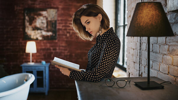 Gorgeous Girl With Book Looking Away Wallpaper