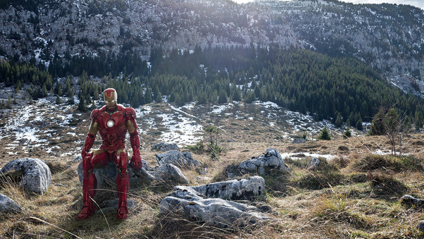 Iron Man Sitting On Stone Mountains Wallpaper