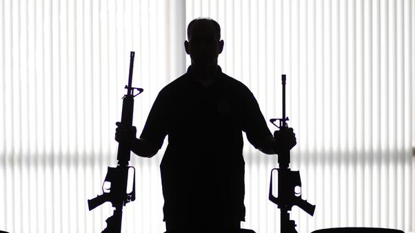 Man With Two Guns Wallpaper