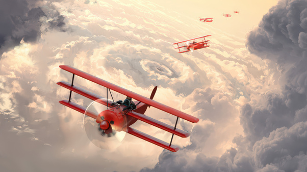 Red Baron Biplanes Flying Through Clouds (2560x1440) Resolution Wallpaper