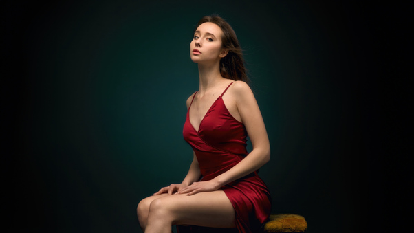 Red Dress Beautiful Girl Sitting On Table Wallpaper