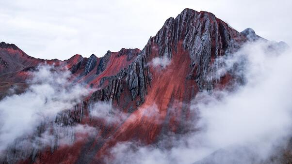 Red Mountain Peeking Out Behind The Clouds Cusco Peru Wallpaper