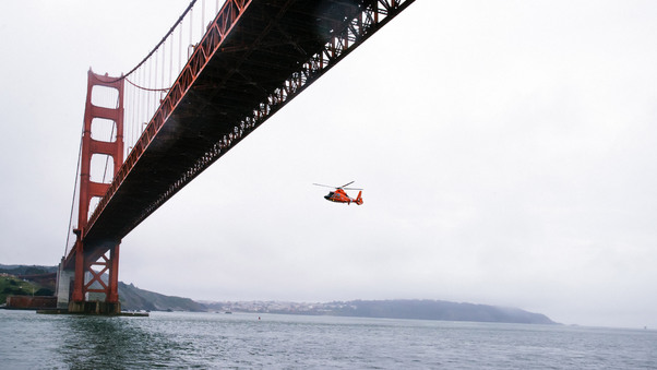 Rescue Helicopter Flying Under Golden Gate Bridge Wallpaper