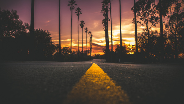 Road In City During Sunset Wallpaper