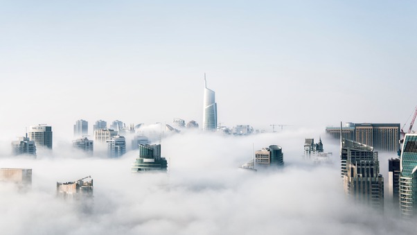 Skyscraper Buildings Covered In Fog Wallpaper