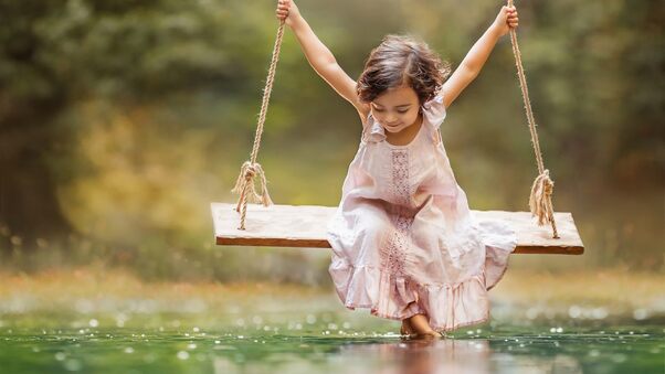 Small Girl Taking Swing Wallpaper