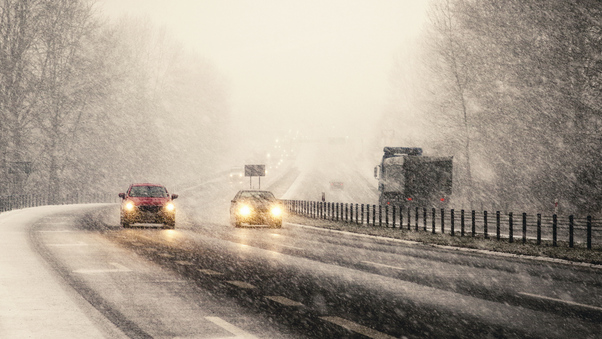 Snowstorm On Highway Vehicles Wallpaper