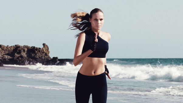 Sports Model Running On Beach Wallpaper