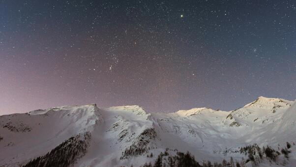Starry Peaks Snow Covered Mountain Majesty Wallpaper