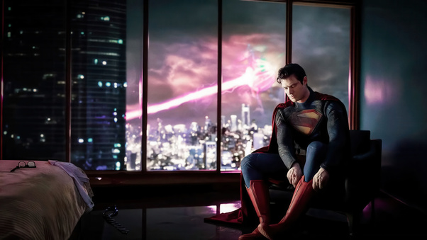 Superman Adjusting His Shoes Wallpaper