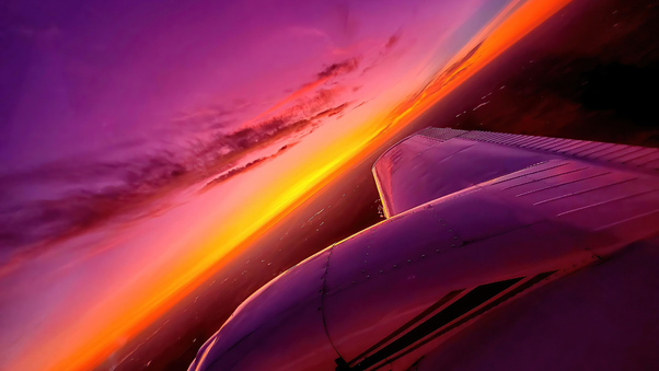 synthwave-sunset-plane-view-4k-ce.jpg