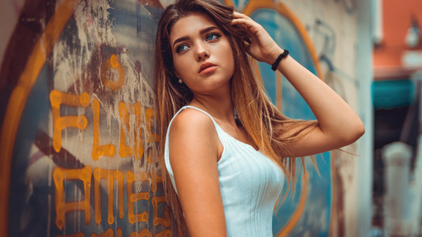 Tanned Girl With Blue Eyes Wallpaper