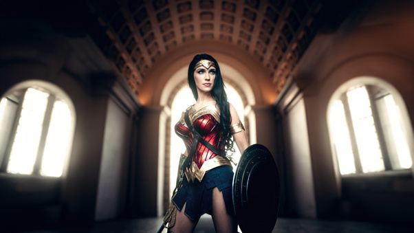 Warrior Princess A Captivating Wonder Woman Girl Cosplay Wallpaper