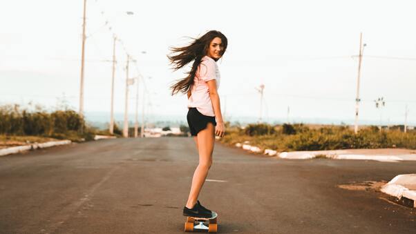 Woman Riding Skateboard At The Road 5k Wallpaper
