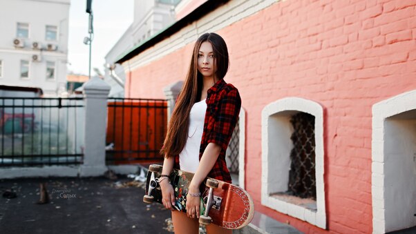 Women Wearing Shirt With Skateboard Outdoors Wallpaper