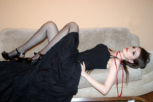 Black Dress Model Lying On Sofa (2048x1152) Resolution Wallpaper