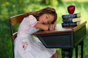 Child Sleeping On Table