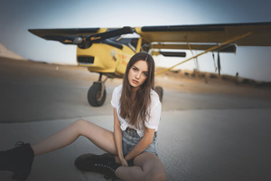 Cute Girl Posing Beside A Plane (2560x1024) Resolution Wallpaper