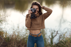 Cute Girl With Camera Smiling Wallpaper